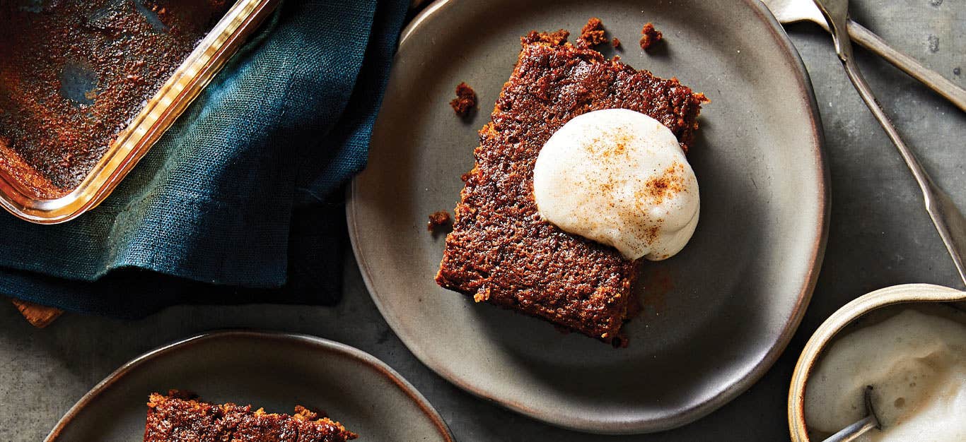 Pioneer Gingerbread with a dollop of aquafaba whipped cream on a gray ceramic plate