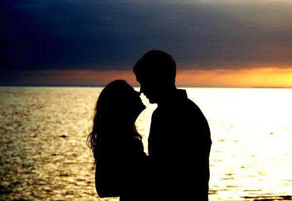 Couple at the beach at sunset