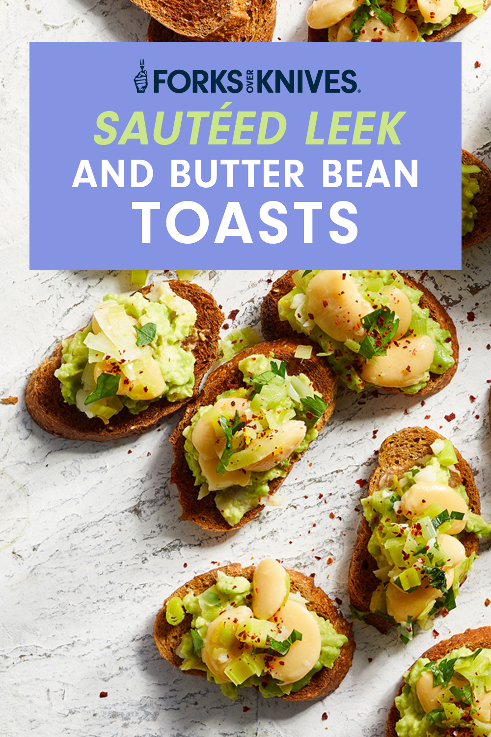 Sautéed Leek and Butter Bean Toasts on a white countertop next to lemon wedges and bowl of paprika