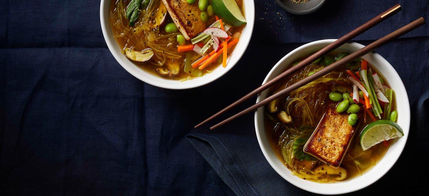 Spaghetti Squash Pho in two white bowls with chopsticks