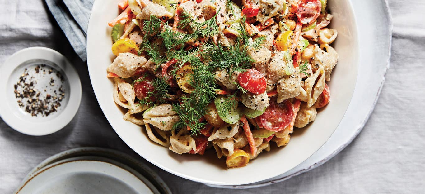 Veggie Potluck Pasta Salad in a white ceramic dish