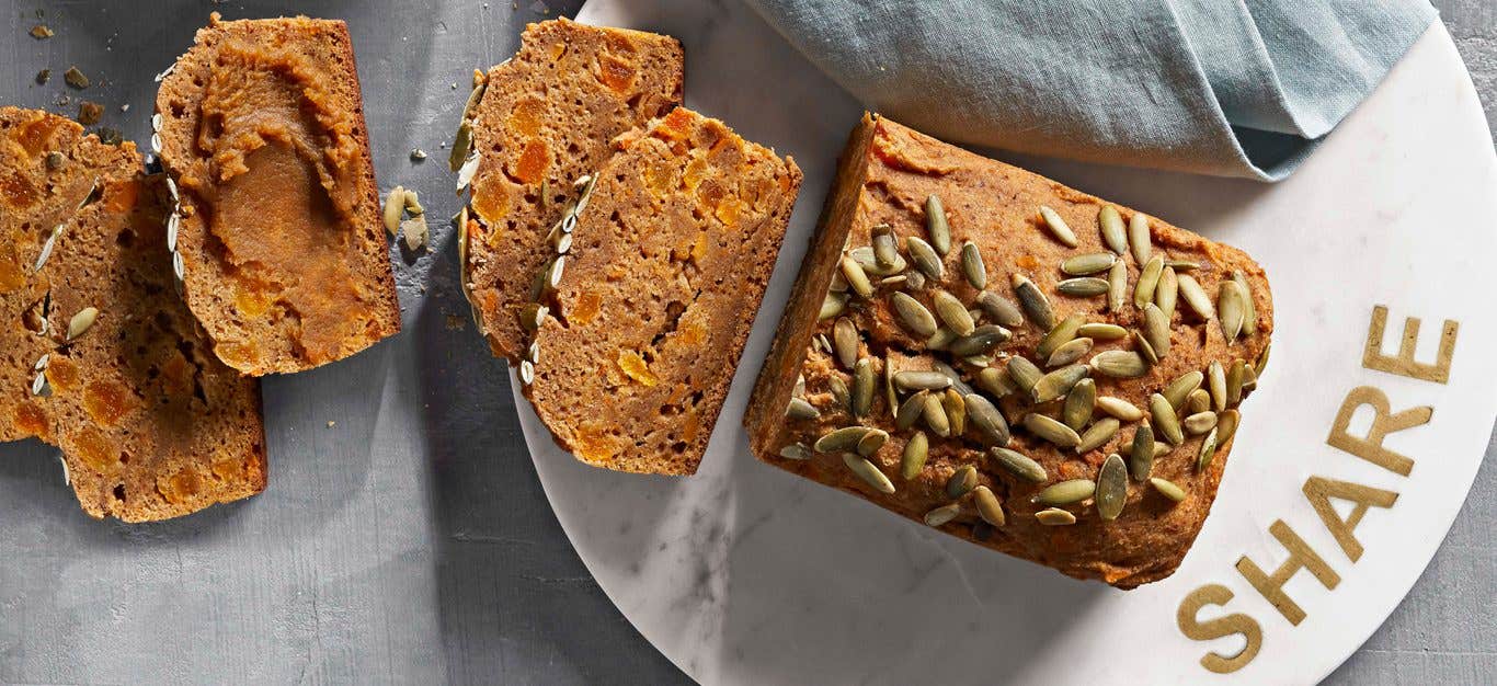 Sweet Potato Bread on a white marble plate that says "share" in gold letters