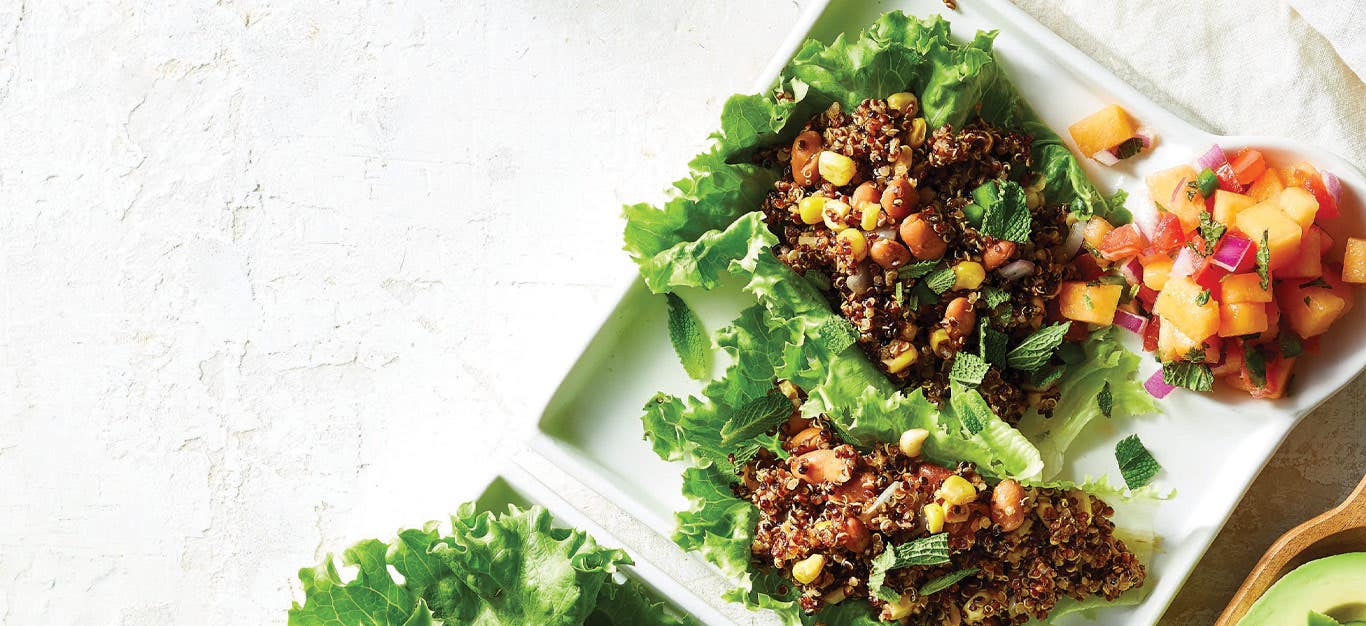 Taco Lettuce Wraps with Melon Salsa on square white plates