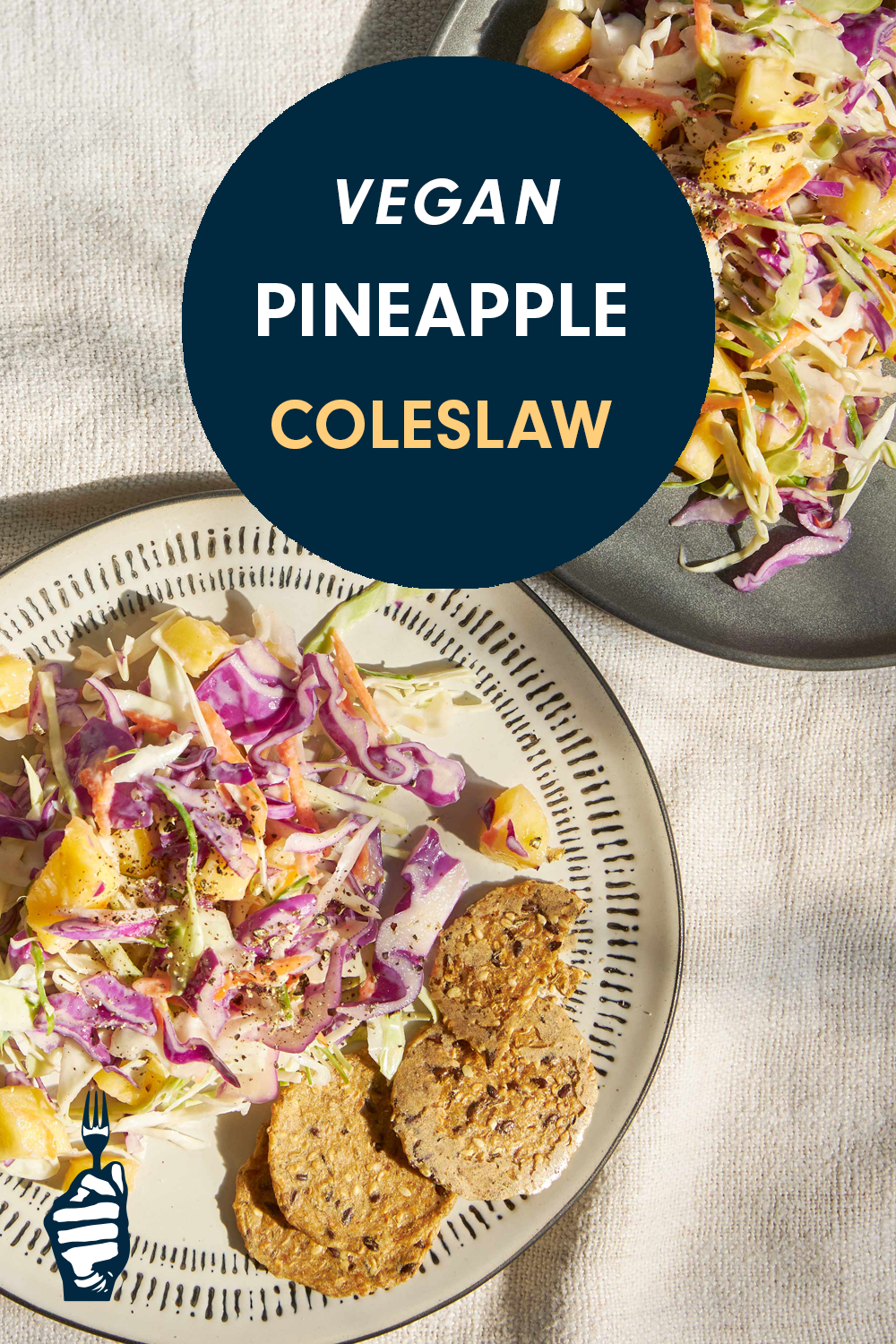 Two plates with a colorful coleslaw and whole grain crackers. Text reads, "Vegan Pineapple Coleslaw"