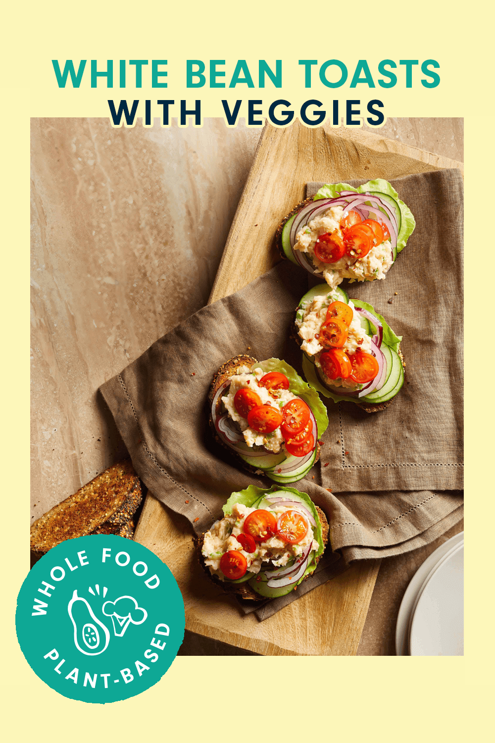 Four pieces of toast topped with veggies on a brown cloth napkin resting on a wood cutting board. Text at the top of the images says, "White Bean Toasts with Veggies"