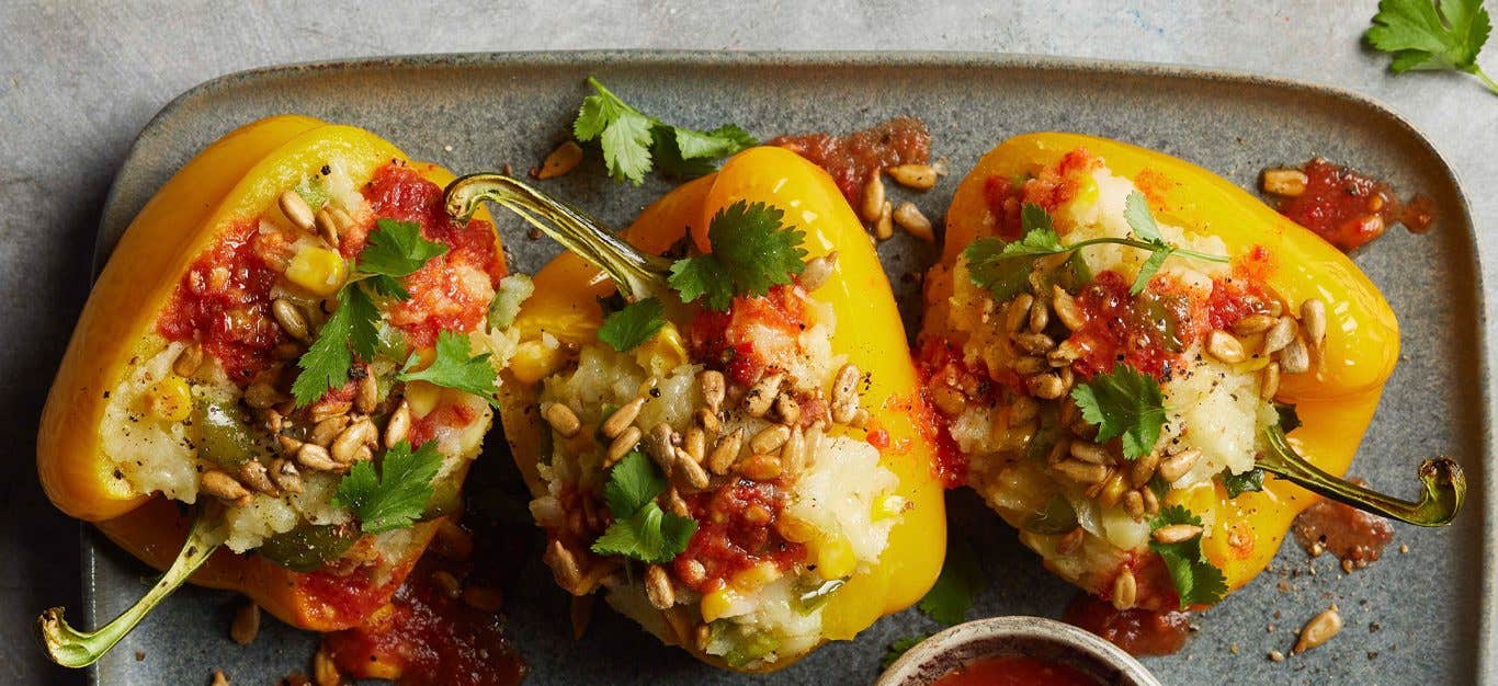 Yellow Bell Pepper Boats with Homemade Hot Sauce on a gray tray