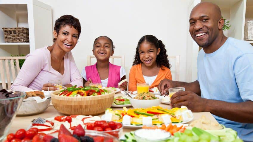 African American Parents Children Family Eating At Dining Table