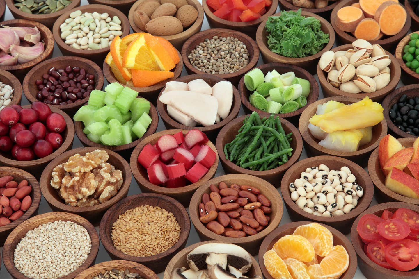 Healthy super food collection in wooden bowls. High in antioxidants, vitamins, minerals and anthocyanins.