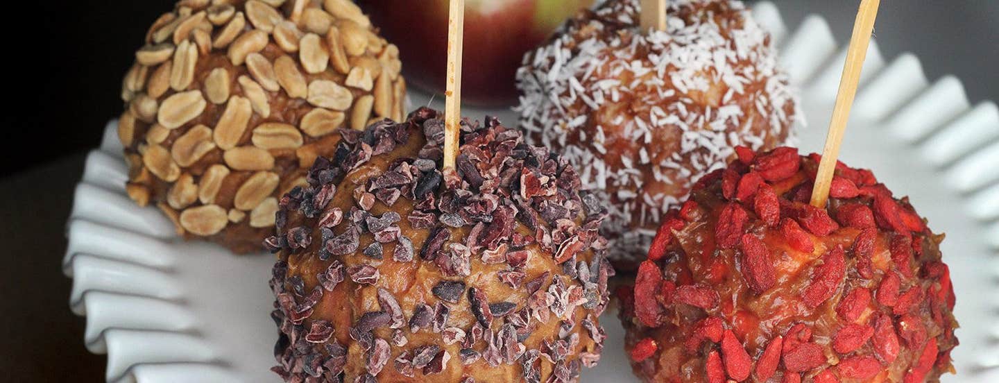 Healthy Caramel Apples covered with nuts, goji berries, and coconut