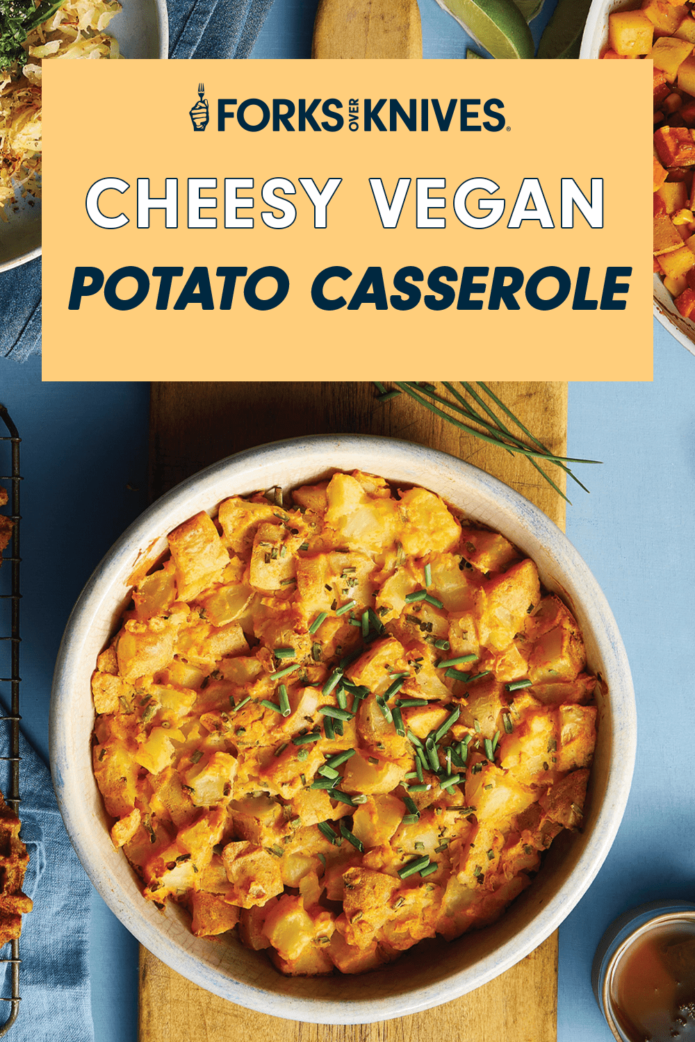 A yellow-hued bowl of cubed creamy potatoes, with text that reads, "Cheesy Vegan Potato Casserole"