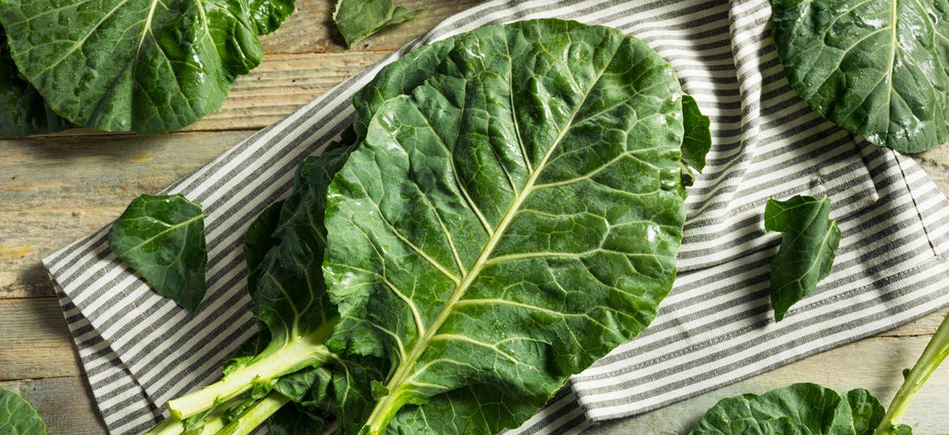 Collard Greens on a dish towel and cutting board