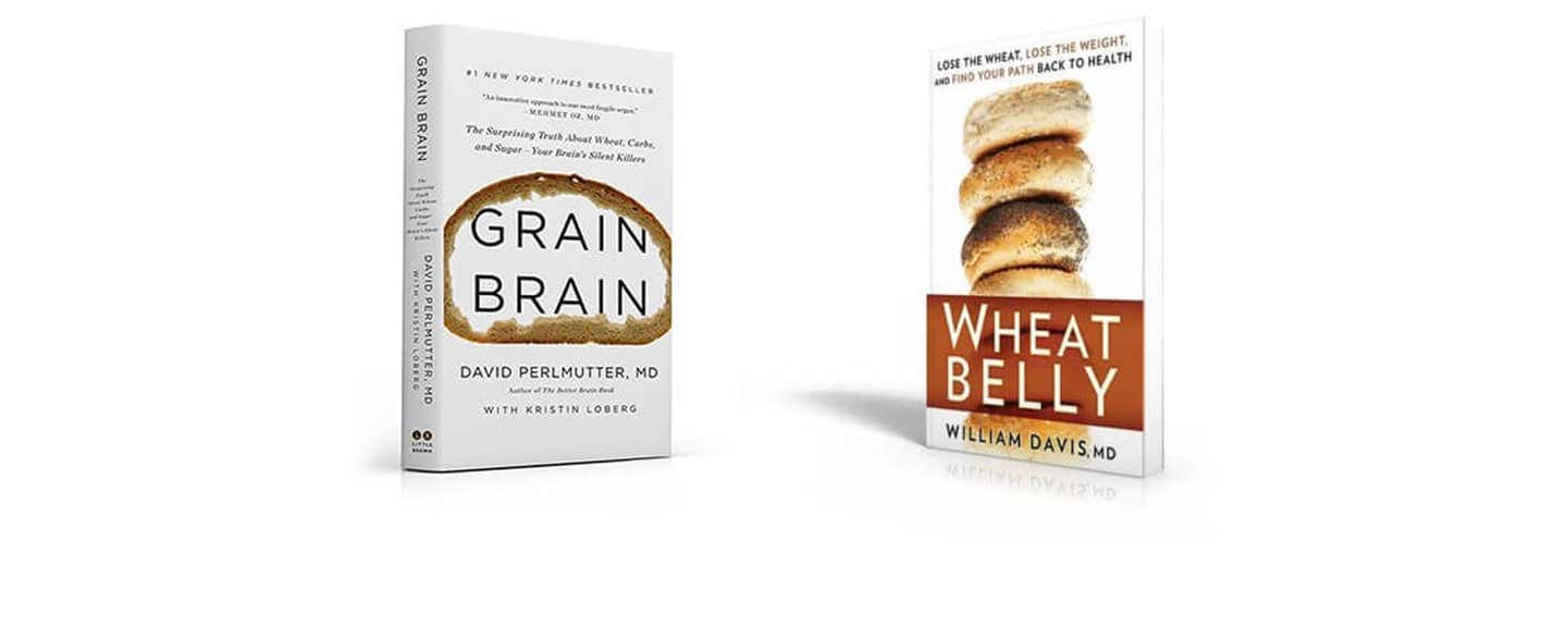 Two books stand up on a white background: "Grain Brain," and "Wheat Belly"