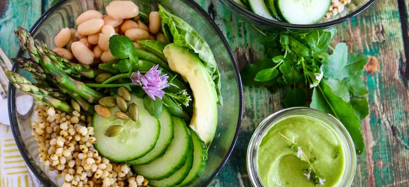 Green Goddess Grain Bowl with cucumber, asparagus, white beans and sorghum and a small dish of Green Goddess Dressing