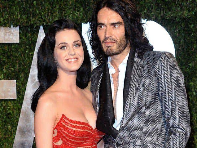 Katy Perry and Russell Brand pose for photographers after watching the Forks Over Knives film