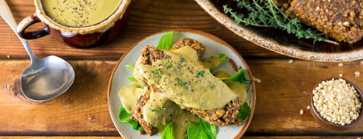 Two slices of Lentil Rice Loaf on a wooden table