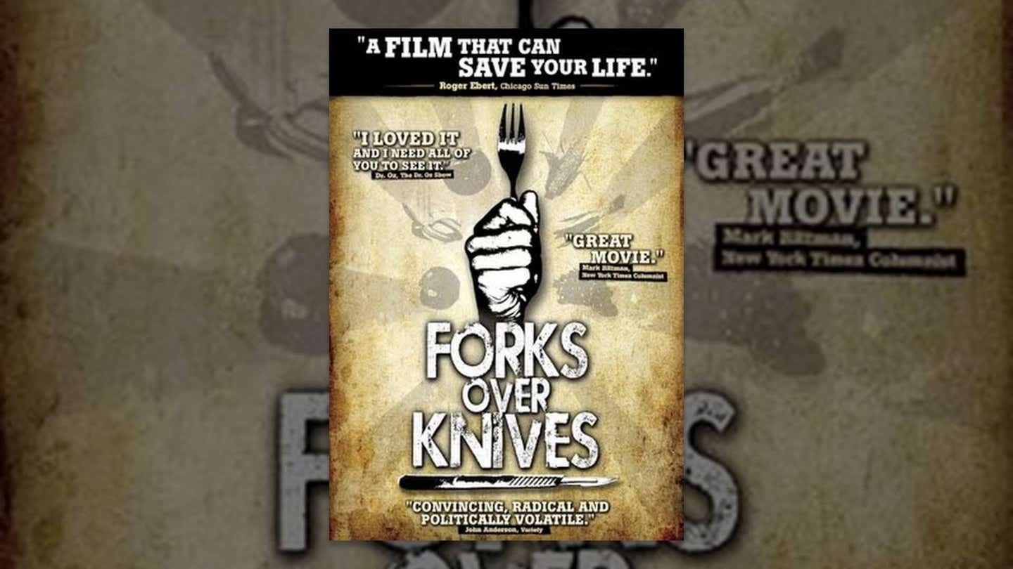 Forks Over Knives movie poster with an image of a fist holding a fork