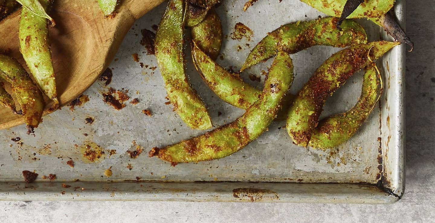 Roasted edamame on a sheet pan seasoned with spices