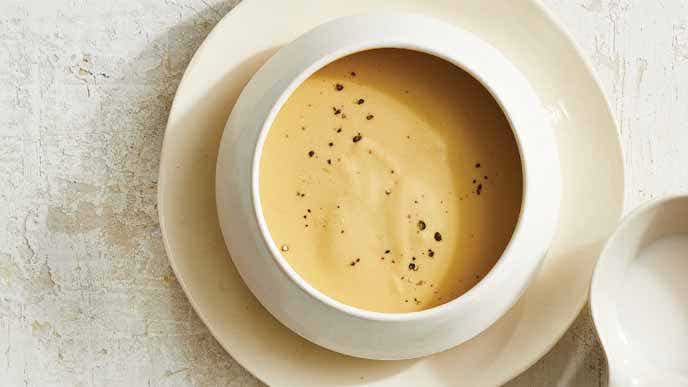 Velvety Cheese Sauce in a white ceramic bowl