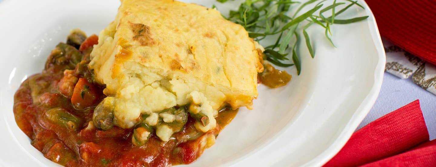 A serving of Plant-Based Shepherd's Pie on a white plate