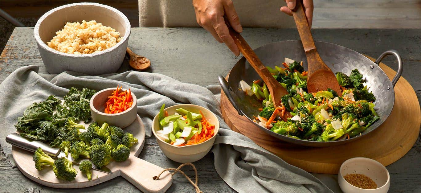 Table with stir-fry ingredients and equipment