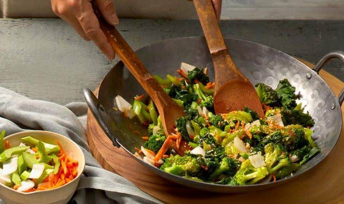 Table with stir-fry ingredients and equipment