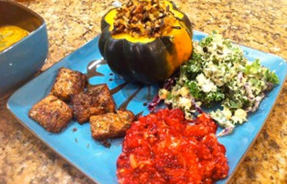 Tempeh Italiano on a plate with other WFPB side dishes