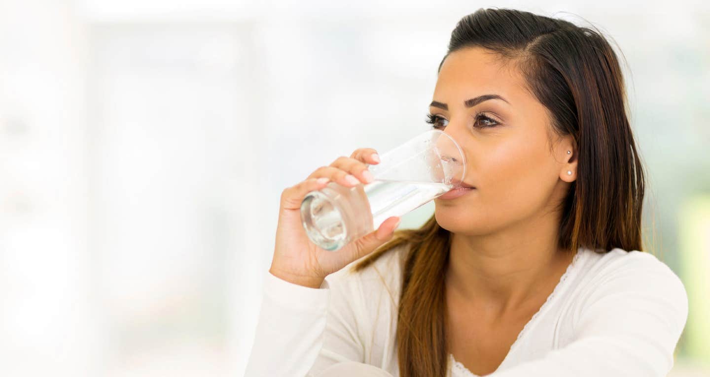 Young woman drinking water