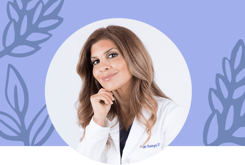 Headshot of a happy female doctor in a lab coat