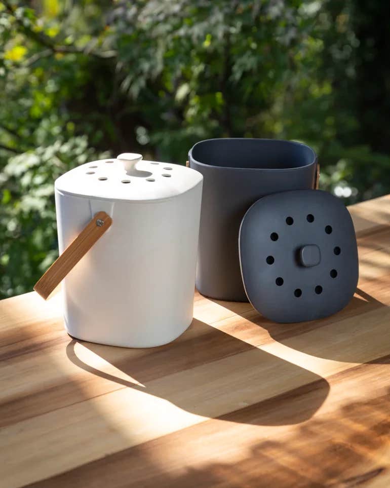 KITCHEN COMPOSTERS ON A WOODEN TABLE