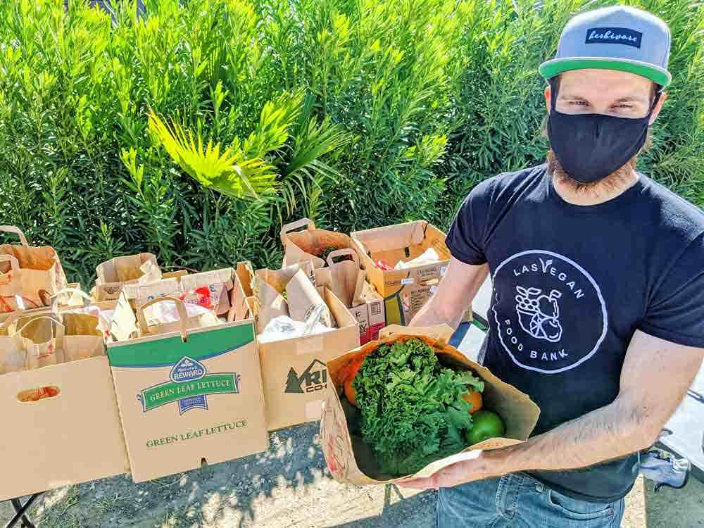 Director of Operations Chris McNulty prepares vegan groceries for distribution.