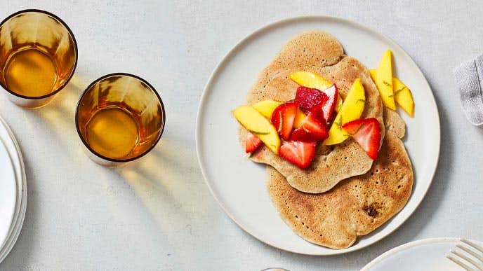 Strawberry Banana pancakes on a white plate